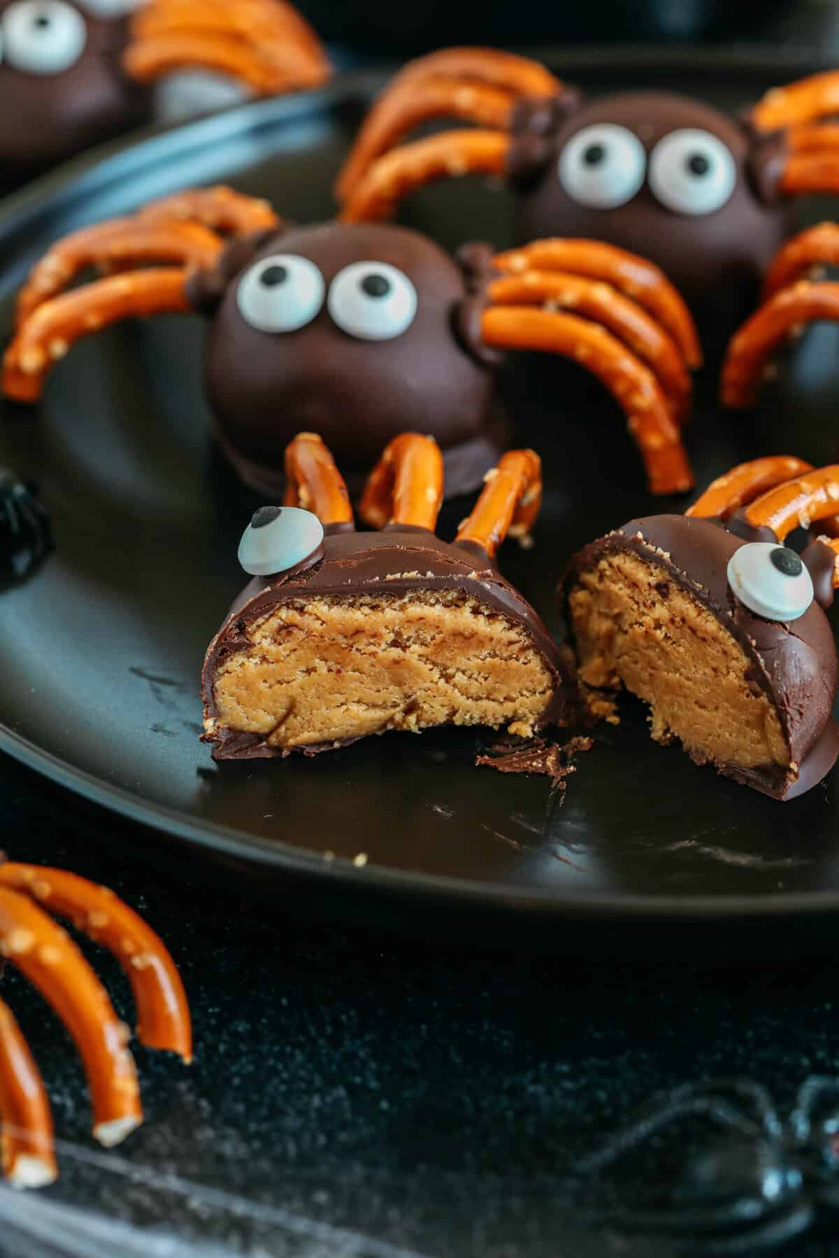 Get festive this Halloween with these tasty Chocolate Peanut Butter Spider Balls made with just 5 simple ingredients and zero baking required! The perfect sweet and salty treats that are easy to make and your kids will love!