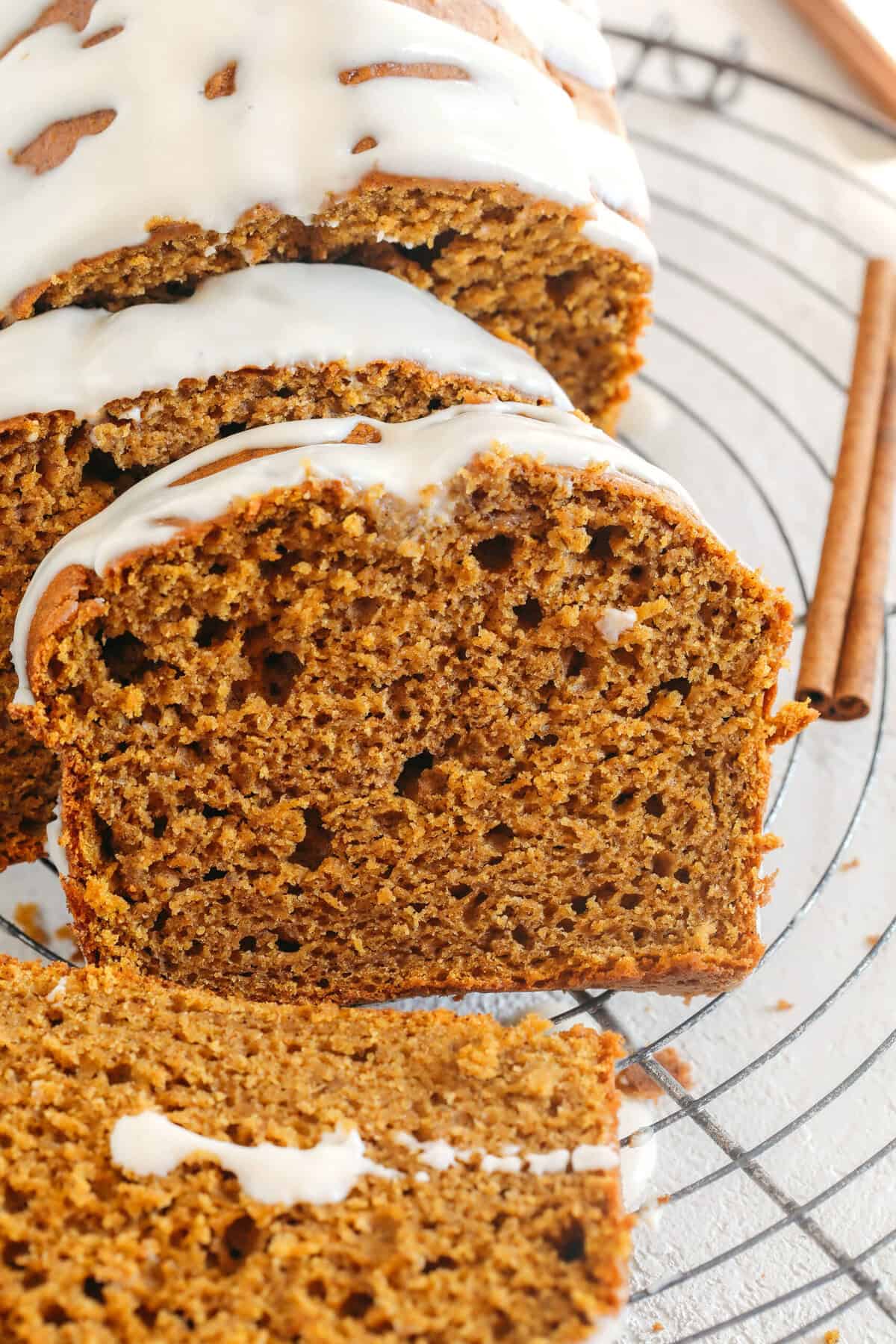 The BEST Healthy Pumpkin Bread recipe that is moist, loaded with pumpkin flavor and made without any butter or refined sugar! Topped with a delicious maple cream cheese glaze for the perfect fall treat this season!
