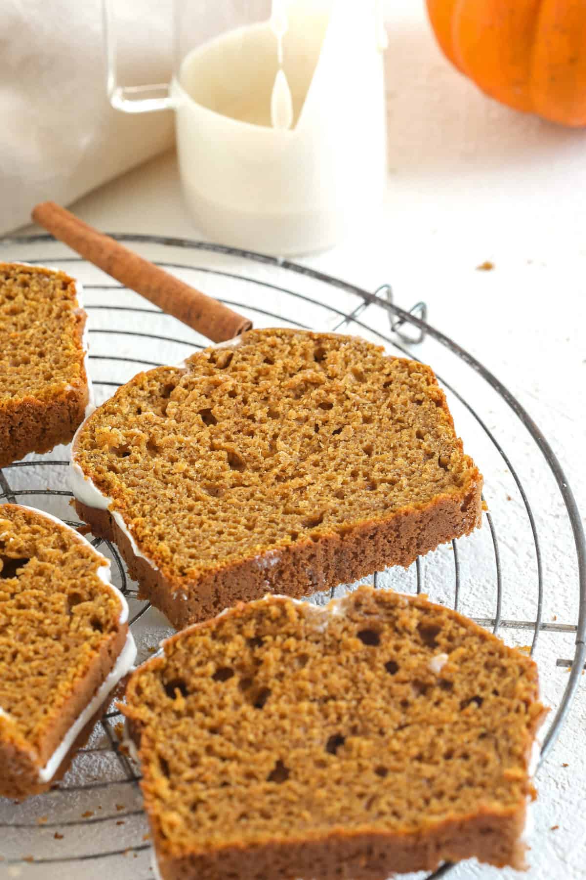 The BEST Healthy Pumpkin Bread recipe that is moist, loaded with pumpkin flavor and made without any butter or refined sugar! Topped with a delicious maple cream cheese glaze for the perfect fall treat this season!