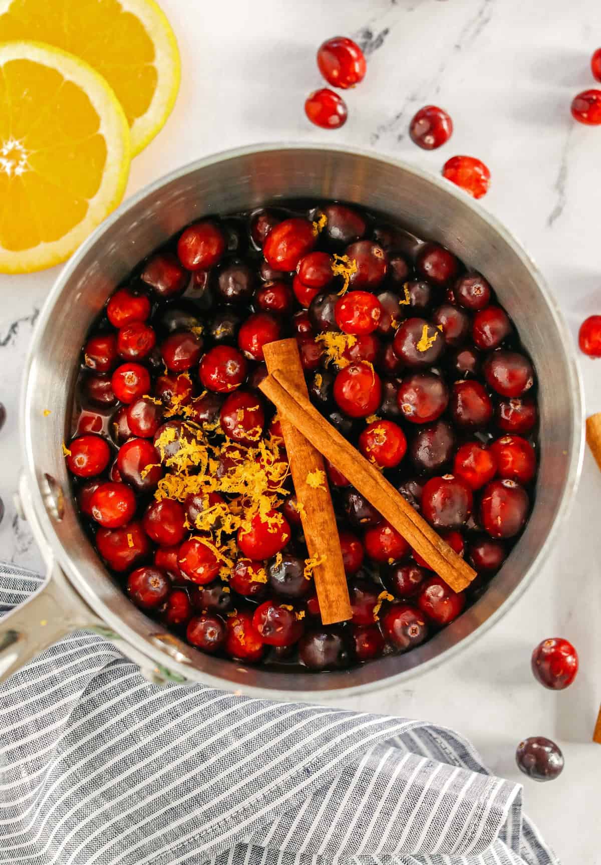This Healthy Cranberry Sauce is naturally sweetened made with maple syrup, fresh orange juice, cinnamon, ginger and deep rich flavors from a little port wine. Sweet, tangy and the perfect addition to your Thanksgiving and Christmas table this season!