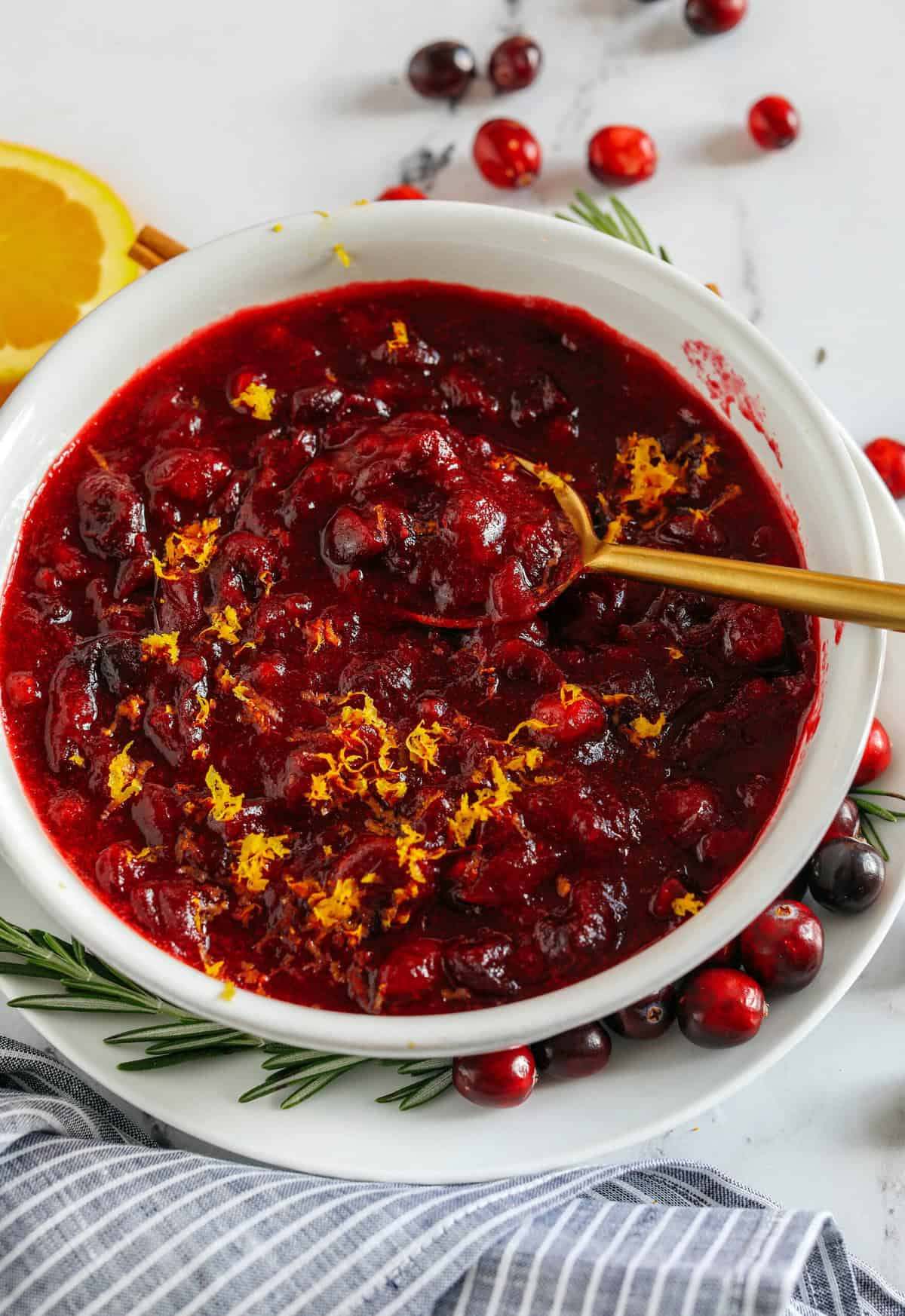 This Healthy Cranberry Sauce is naturally sweetened made with maple syrup, fresh orange juice, cinnamon, ginger and deep rich flavors from a little port wine. Sweet, tangy and the perfect addition to your Thanksgiving and Christmas table this season!