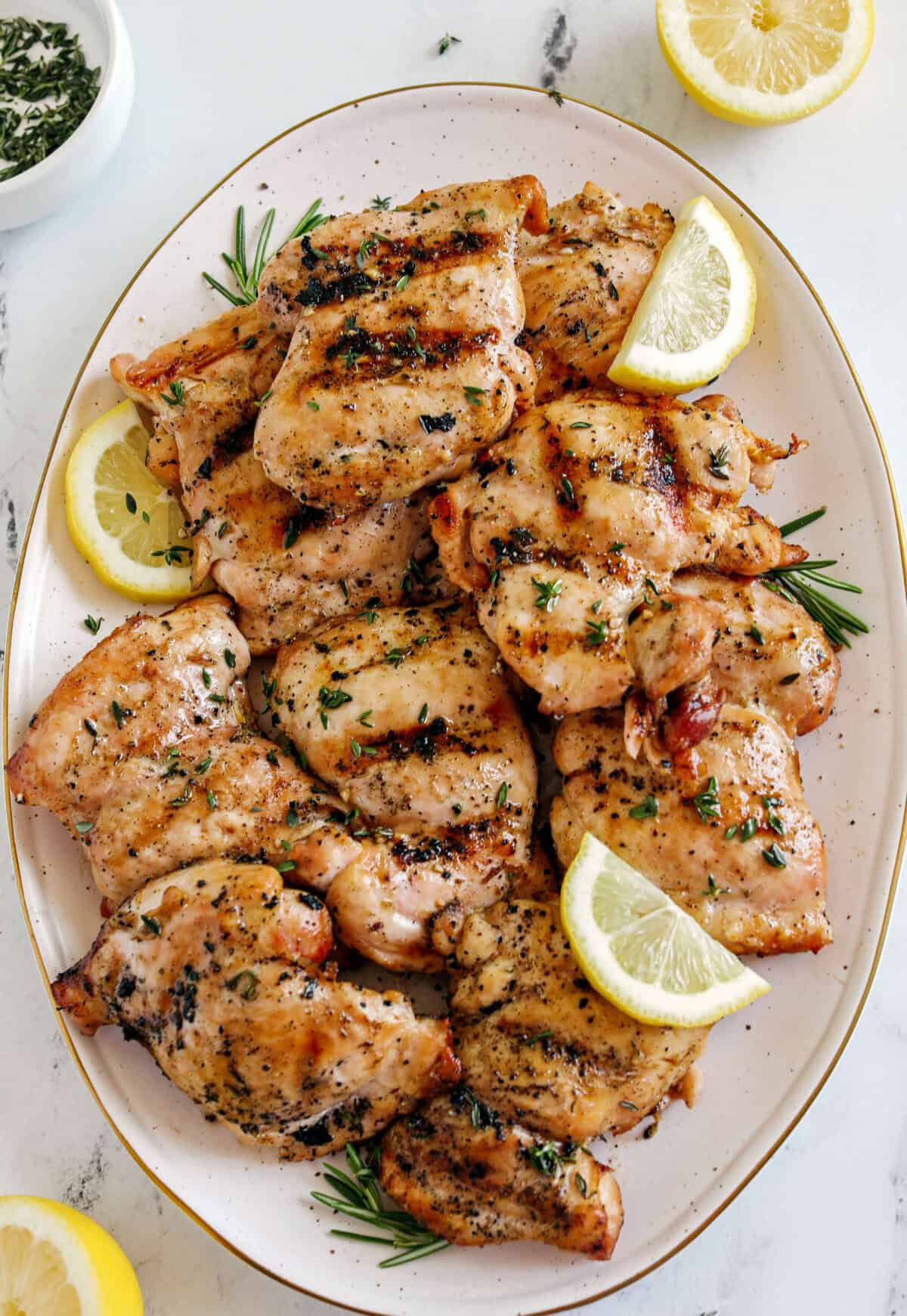 This Lemon Herb Grilled Chicken is easily made with just a few simple ingredients for a delicious, healthy meal! Packed with so much flavor thanks to tangy lemon juice, tons of garlic, and fresh thyme!