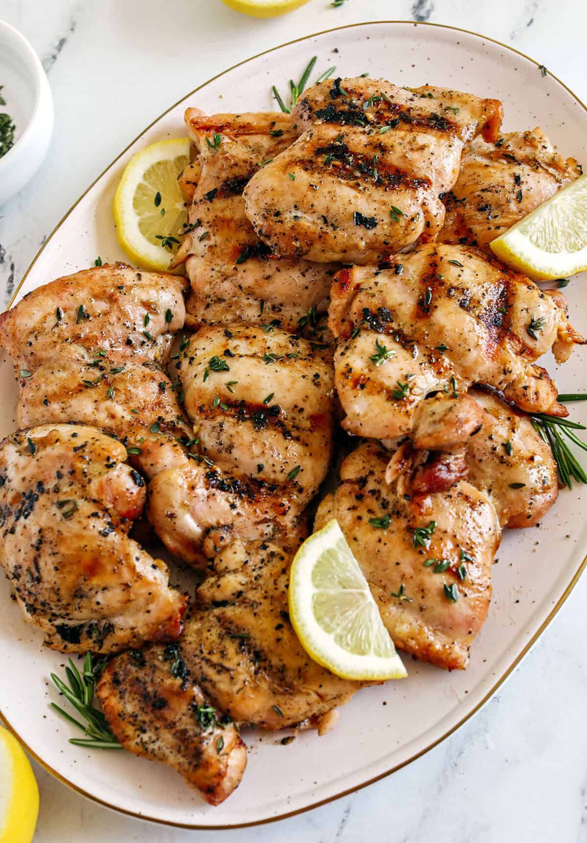 This Lemon Herb Grilled Chicken is easily made with just a few simple ingredients for a delicious, healthy meal! Packed with so much flavor thanks to tangy lemon juice, tons of garlic, and fresh thyme!
