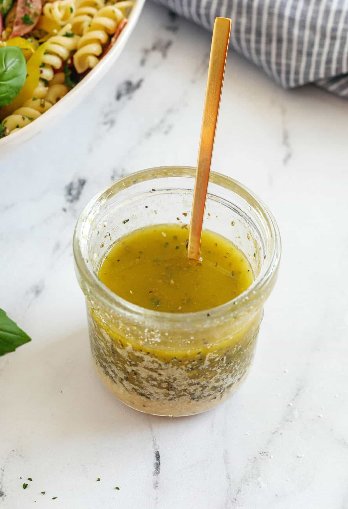 You'll love this zesty homemade Easy Italian Dressing made in just minutes with a few simple pantry ingredients! Perfect for salads, veggies, marinades, and more!