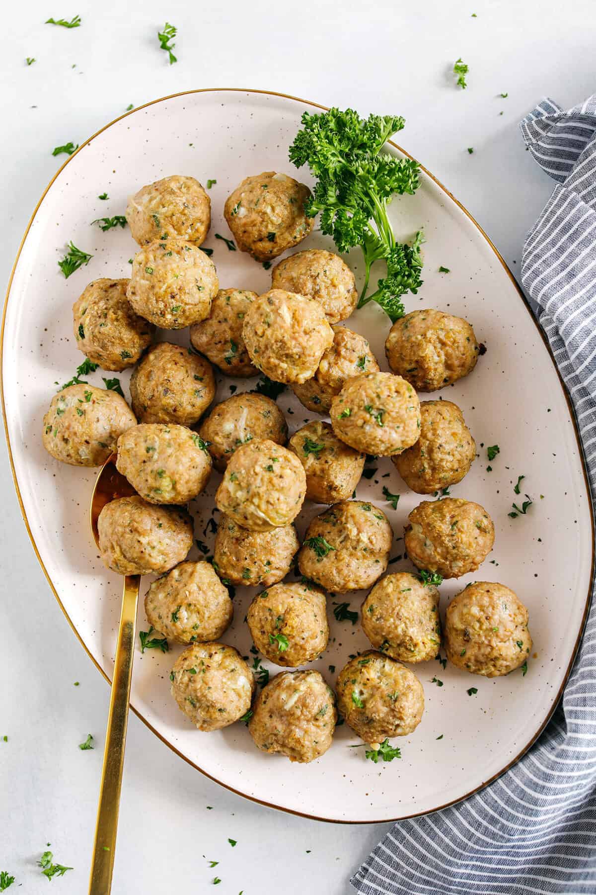 These Easy Turkey Meatballs are tender, juicy and packed with flavor! Made with just a few simple ingredients in under 30 minutes, these baked homemade meatballs can be added to any favorite dish!