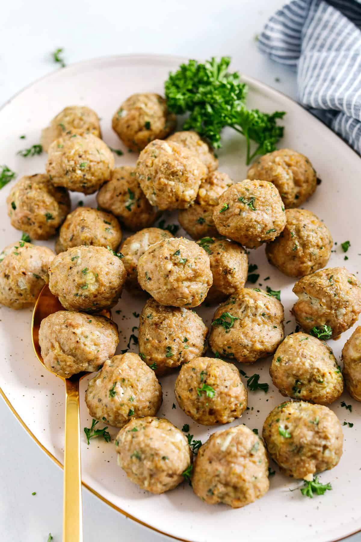 These Easy Turkey Meatballs are tender, juicy and packed with flavor! Made with just a few simple ingredients in under 30 minutes, these baked homemade meatballs can be added to any favorite dish!