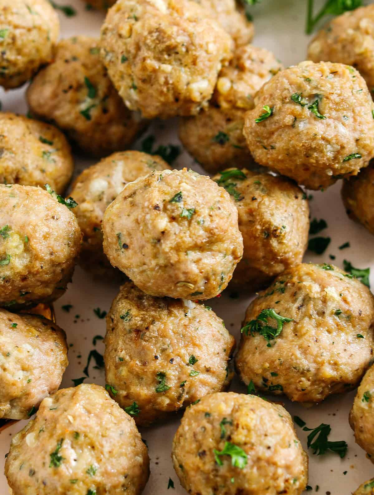 These Easy Turkey Meatballs are tender, juicy and packed with flavor! Made with just a few simple ingredients in under 30 minutes, these baked homemade meatballs can be added to any favorite dish!