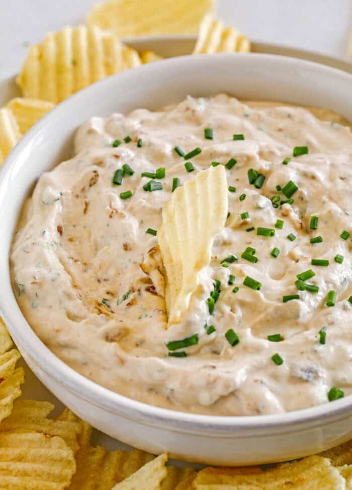 Delicious High Protein French Onion Dip made healthier with protein-packed cottage cheese, caramelized onions, and fresh herbs for the perfect dip to serve with chips, veggies and crackers!