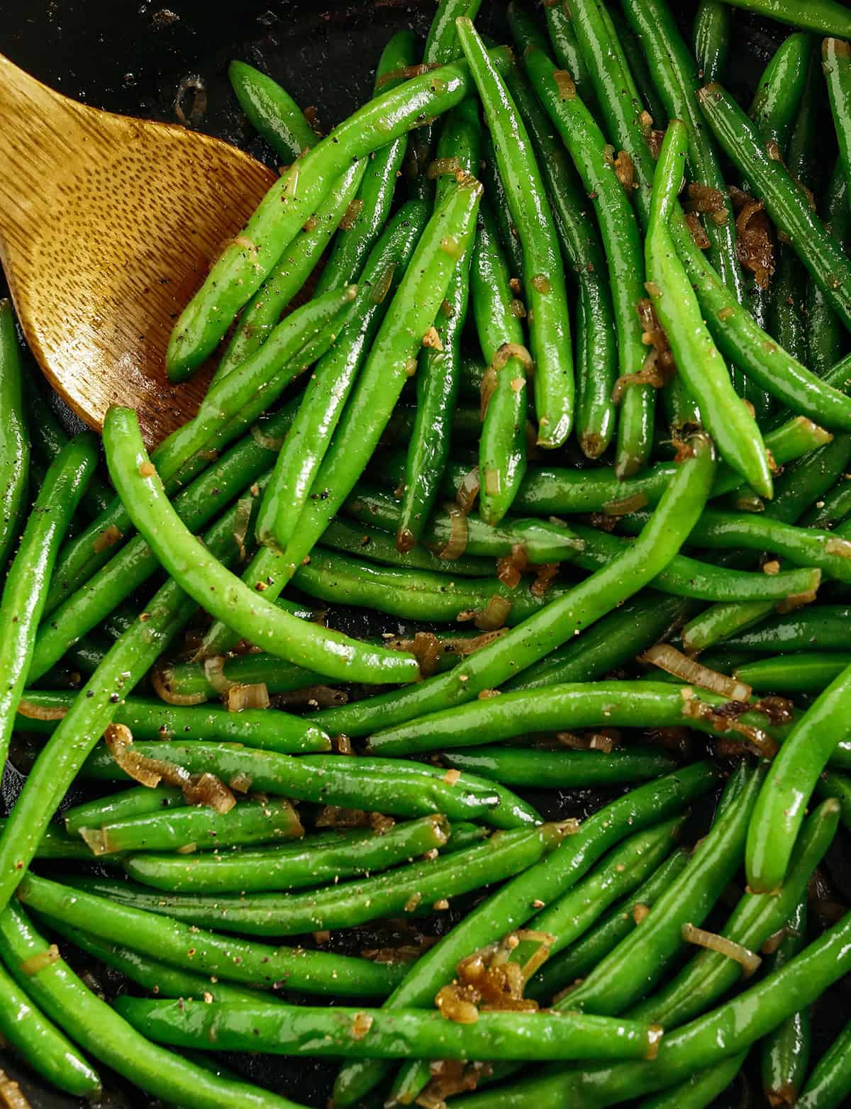 These fresh and crisp Garlicky Green Beans with Caramelized Shallots are a simple, healthy and flavorful side dish that comes together in just 15 minutes! No blanching necessary. Perfect for busy weeknights or served with a holiday meal.