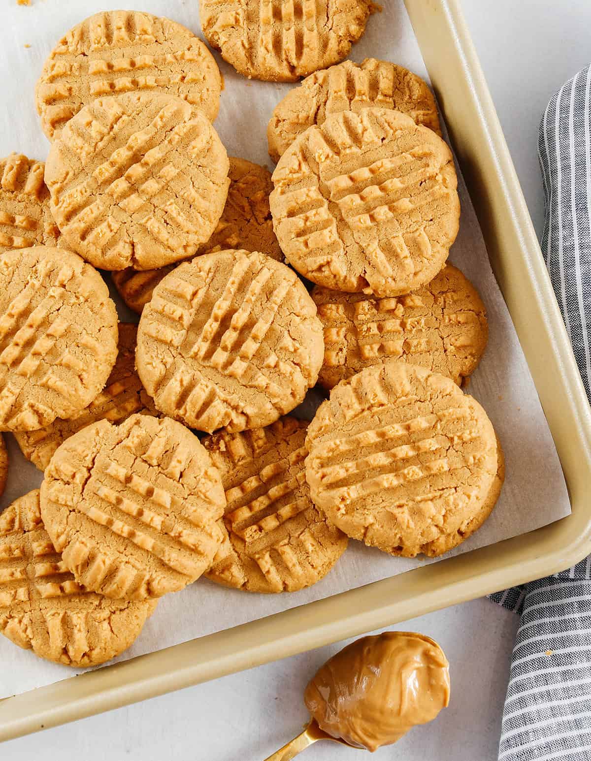 The BEST 5-Ingredient Peanut Butter Cookies recipe made with simple pantry ingredients and zero flour, butter or oil! Soft, chewy cookies with rich peanut butter flavor are the perfect gluten-free sweet treat.