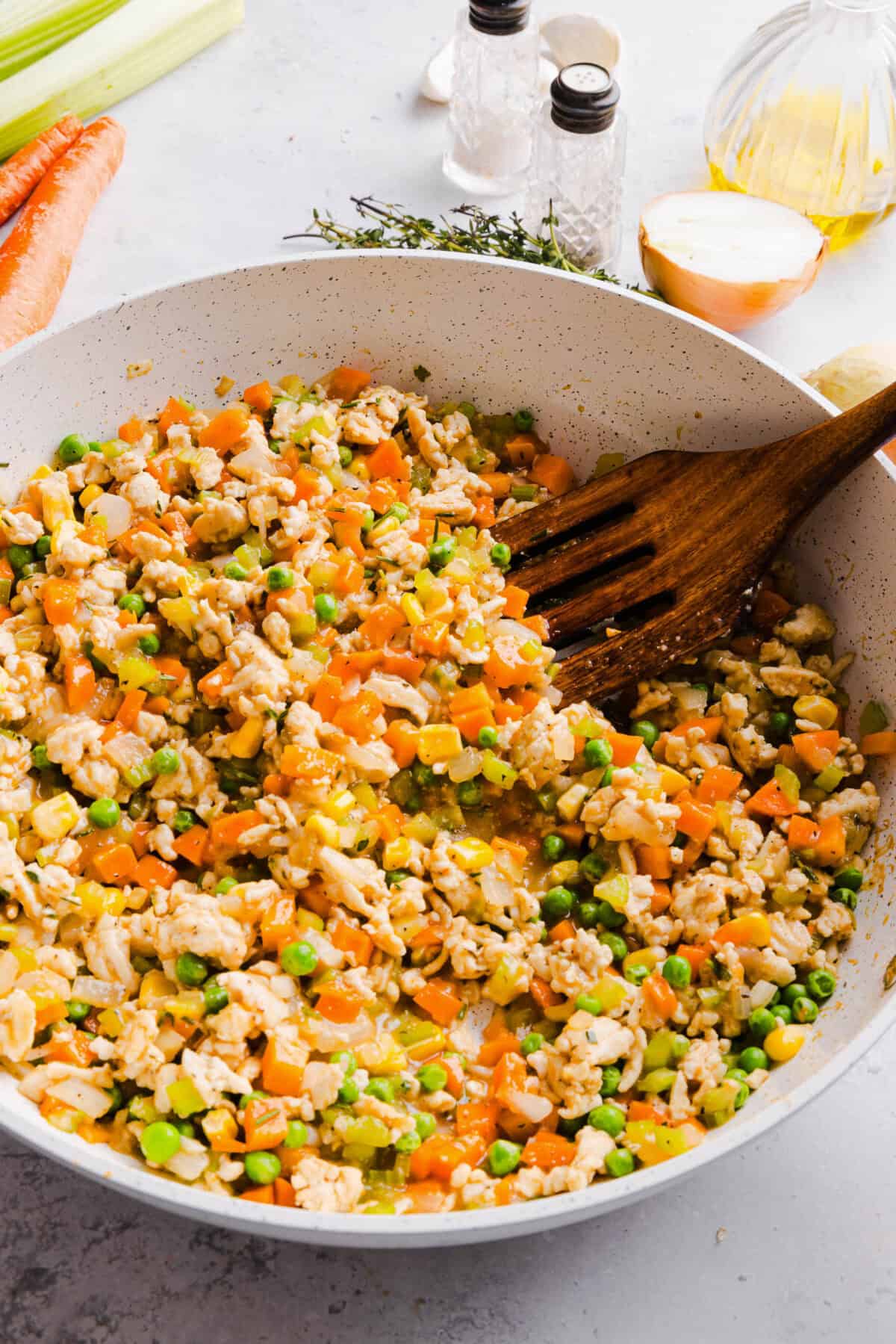Cozy and delicious Healthy Turkey Shepherd's Pie Recipe made with lean ground turkey, colorful vegetables, rich homemade gravy and topped with lighter mashed potatoes. A healthier twist on a classic comfort food dish the whole family will love!