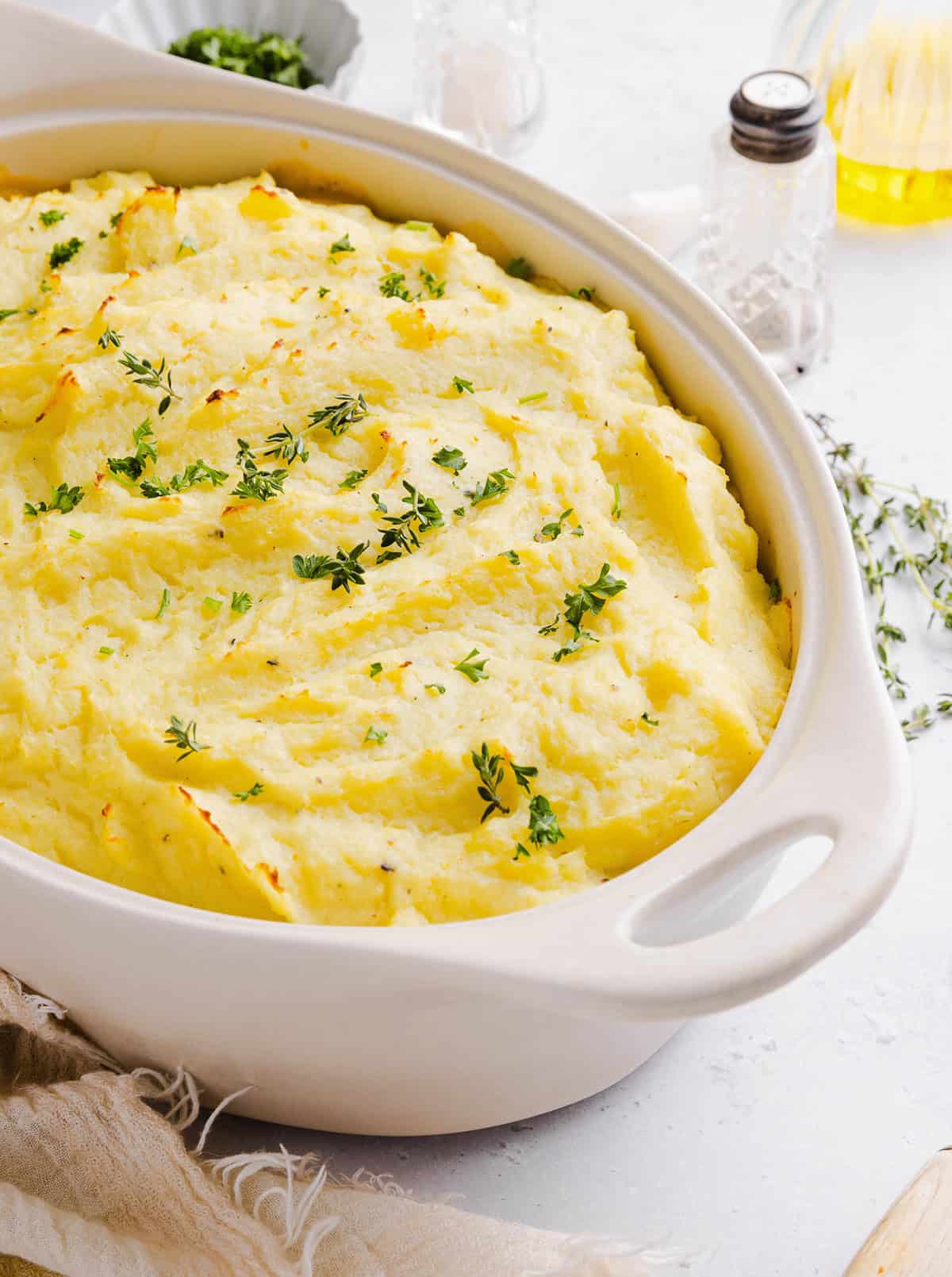 Cozy and delicious Healthy Turkey Shepherd's Pie Recipe made with lean ground turkey, colorful vegetables, rich homemade gravy and topped with lighter mashed potatoes. A healthier twist on a classic comfort food dish the whole family will love!
