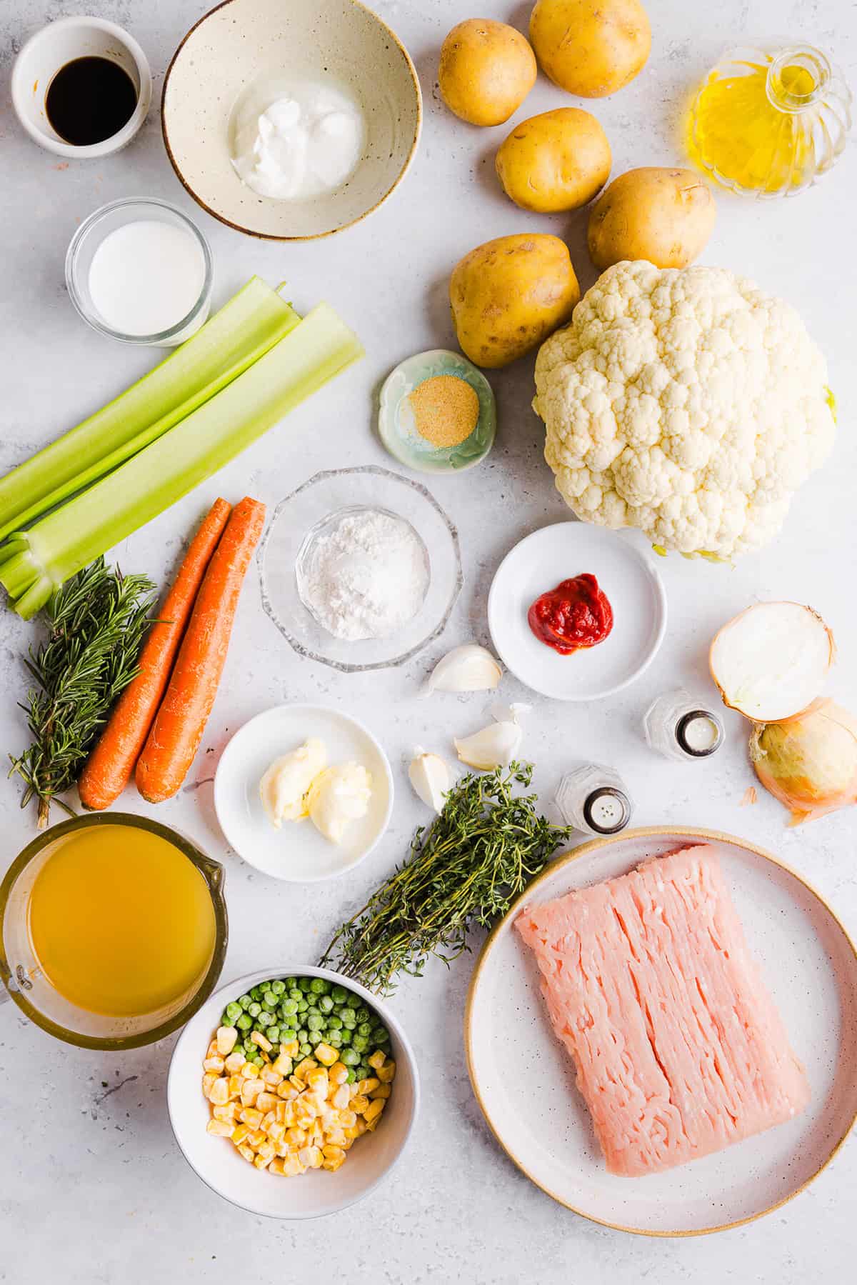 Cozy and delicious Healthy Turkey Shepherd's Pie Recipe made with lean ground turkey, colorful vegetables, rich homemade gravy and topped with lighter mashed potatoes. A healthier twist on a classic comfort food dish the whole family will love!