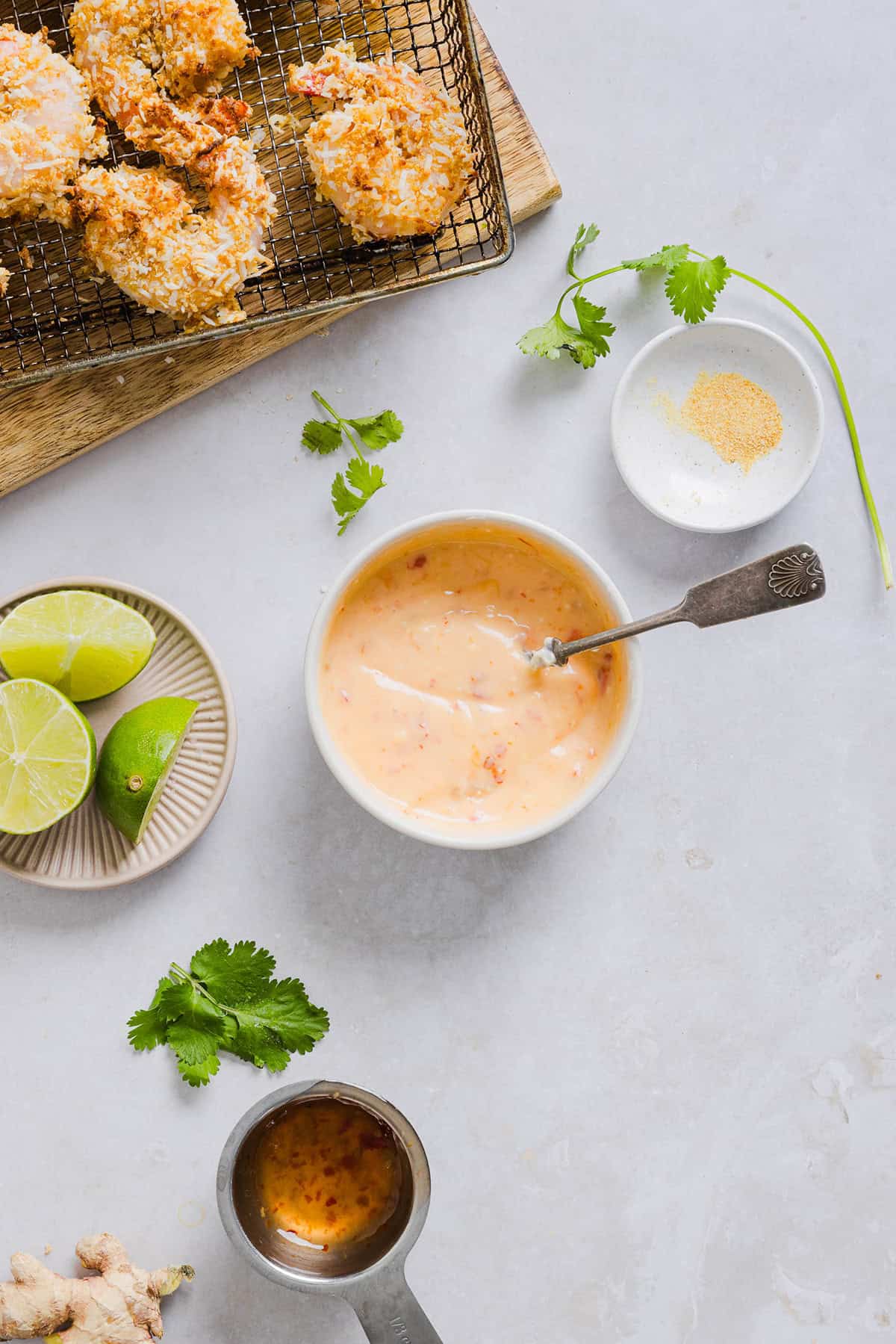 Sweet and Crispy Air Fryer Coconut Shrimp easily made in under 20 minutes and served with the most delicious chili dipping sauce! This appetizer is always a crowd-pleaser, but also makes a filling main dish served with a salad, veggies or in a wrap.