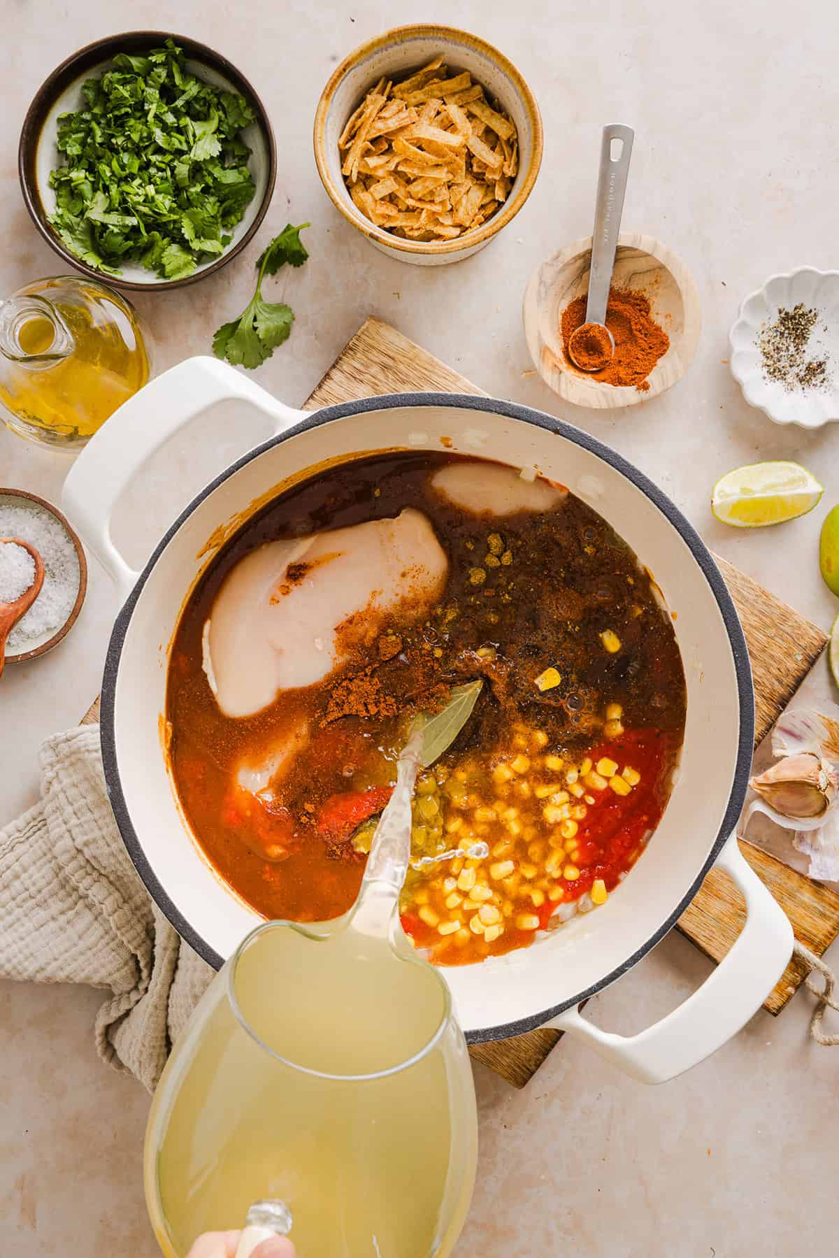 This Easy Chicken Tortilla Soup makes the perfect weeknight meal that can easily be made right in your instant pot, slow cooker or on the stove! Packed with tender shredded chicken, veggies, beans and all the toppings for a delicious, flavor-packed meal!