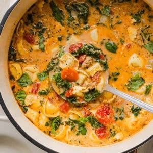 This Creamy Tortellini Soup recipe is cozy, comforting and made with tender cheese tortellini, fresh veggies, herbs and a rich creamy broth. The perfect one pot meal that is both flavorful and satisfying!