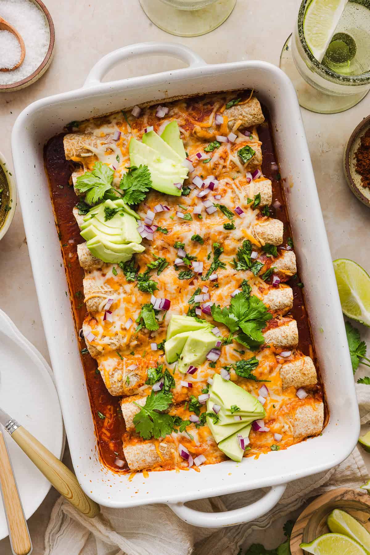 This Healthy Chicken Enchilada recipe is a family favorite made with wholesome, flavorful ingredients for the perfect weeknight meal! The homemade enchilada sauce tastes absolutely amazing! 