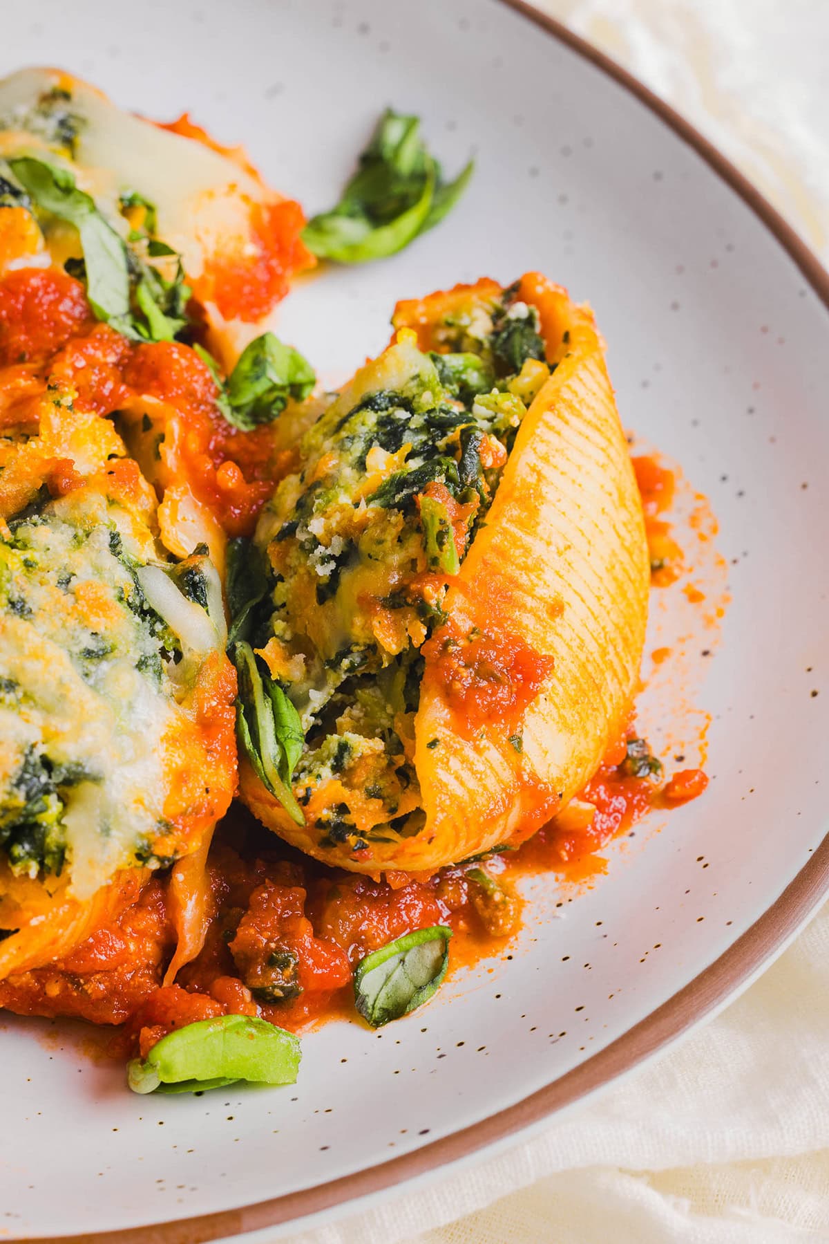 These cozy Veggie and Cheese Stuffed Shells are a family favorite that are loaded with vegetables, easy to freeze and make the perfect weeknight meal! The ultimate comfort food with a healthy twist! 