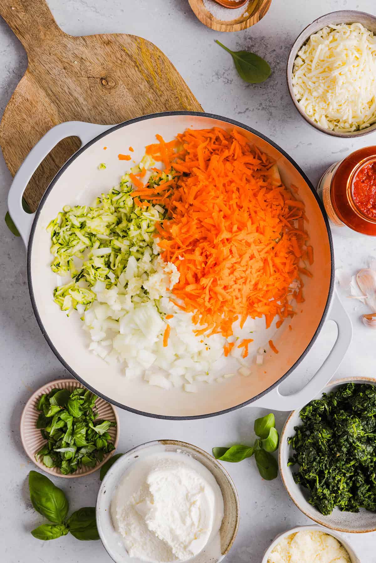 These cozy Veggie and Cheese Stuffed Shells are a family favorite that are loaded with vegetables, easy to freeze and make the perfect weeknight meal! The ultimate comfort food with a healthy twist! 