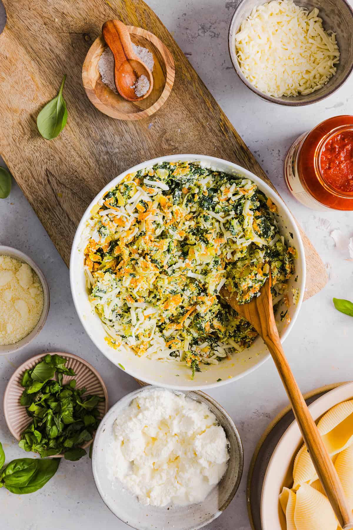 These cozy Veggie and Cheese Stuffed Shells are a family favorite that are loaded with vegetables, easy to freeze and make the perfect weeknight meal! The ultimate comfort food with a healthy twist! 