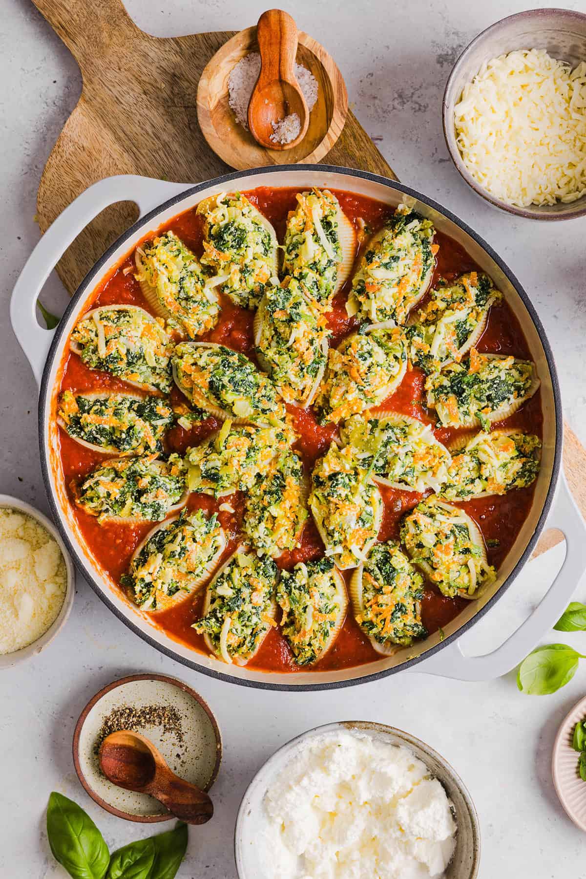 These cozy Veggie and Cheese Stuffed Shells are a family favorite that are loaded with vegetables, easy to freeze and make the perfect weeknight meal! The ultimate comfort food with a healthy twist! 